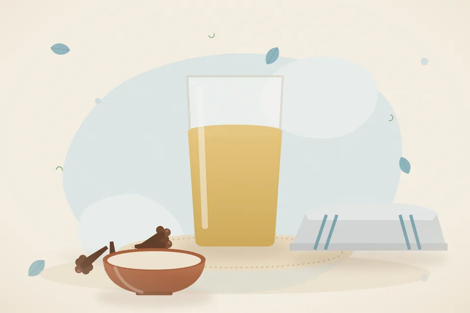 A warm cup of clove water with a pinch of salt in a tiny dish and a whole clove on the saucer.