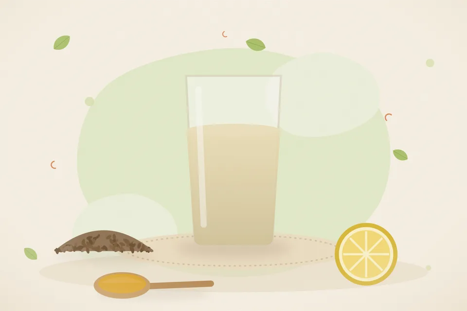 A cup of warm pale water on a kitchen counter with roasted cumin and a cut lemon on a small plate, afternoon light, no people and no lettering.