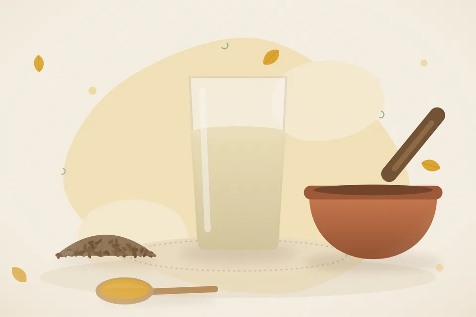 A tiny pinch of hing, roasted cumin seeds and a cup of warm water on a wooden table