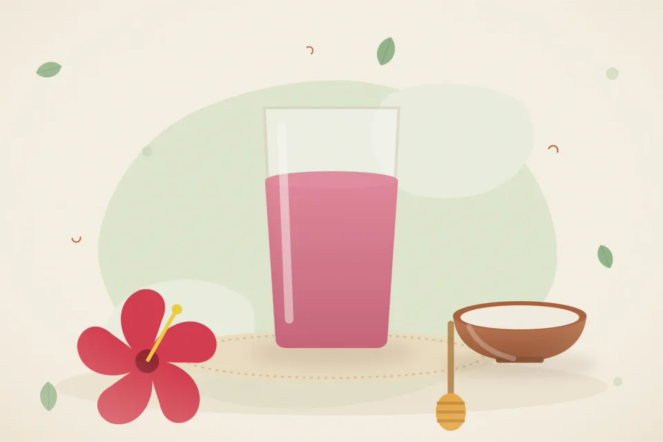 Red hibiscus flowers, a bowl of curd, a honey dipper and a tall glass of pink hibiscus water on a leaf-green background
