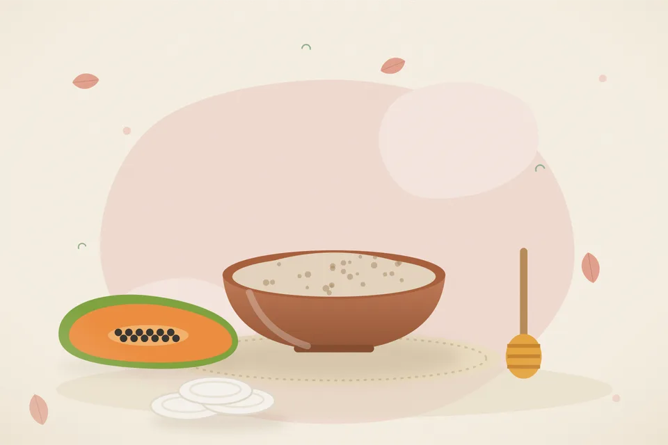 Kitchen still life of ripe papaya pieces and a small spoon of honey on a ceramic plate, with no people and no text.