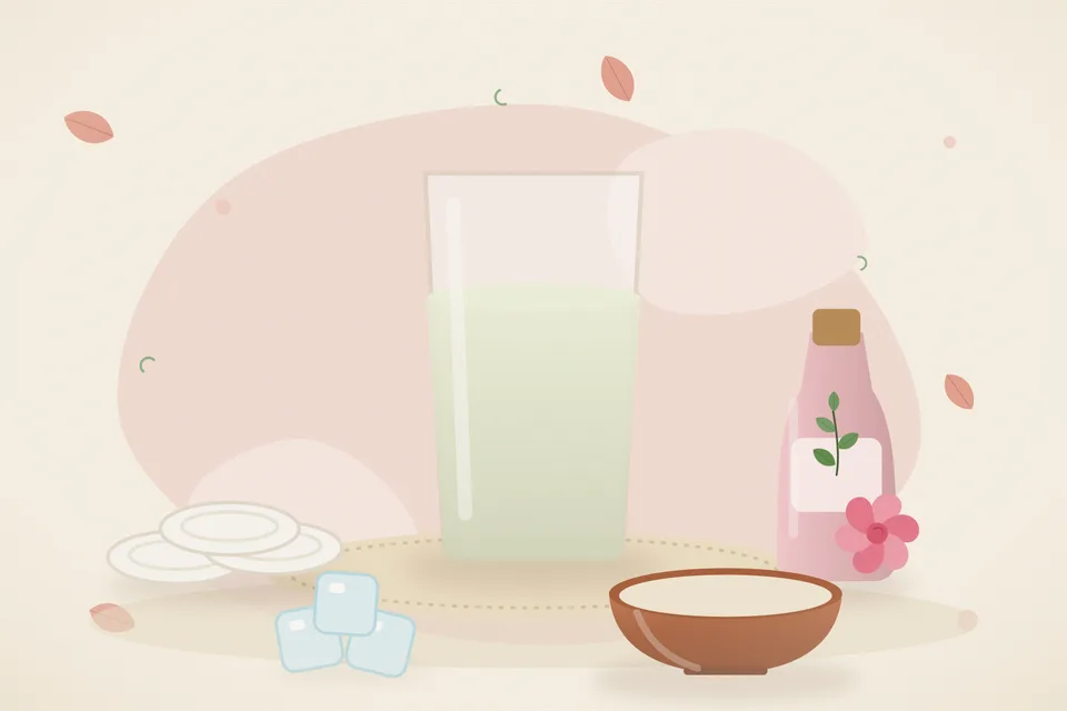 Kitchen still life of a cut potato, fresh potato juice, cotton pads, and rose water on a tray, with no people and no text.