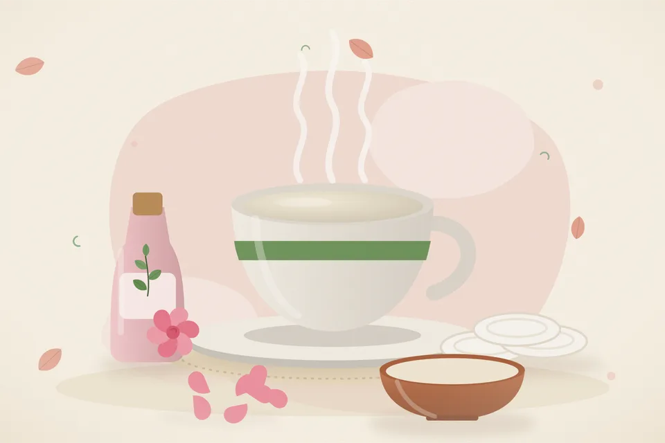 A spoon of milk, a small glass of rose water and clean cotton pads on a steel tray