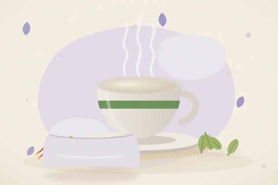 A small steel tumbler of warm milk, two saffron strands, and one cracked green cardamom pod on a wooden kitchen board.