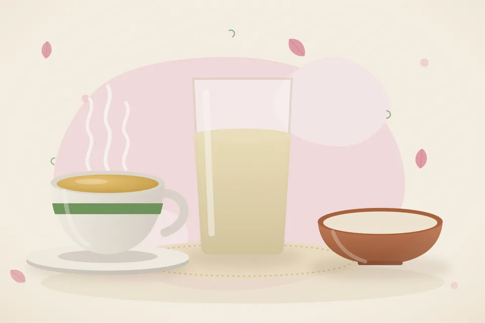 A pinch of pale shatavari powder beside a cup of warm water and a small spoon on a wooden table, evening light, no people and no lettering.