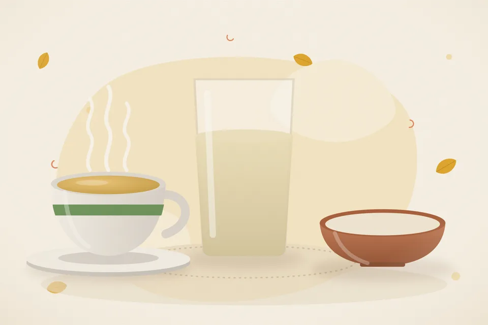 A simple meal plate and a glass of water on a table, with an empty chair pulled in and no phone on the table.