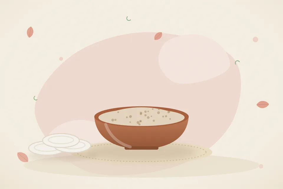 Ripe tomato pulp mixed with fresh curd in a small bowl and a spoon on a kitchen counter