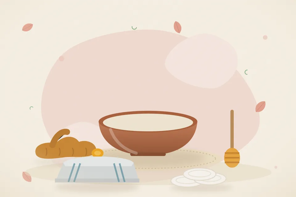 A pinch of turmeric powder and a drop of honey on a steel spoon beside a folded cotton cloth